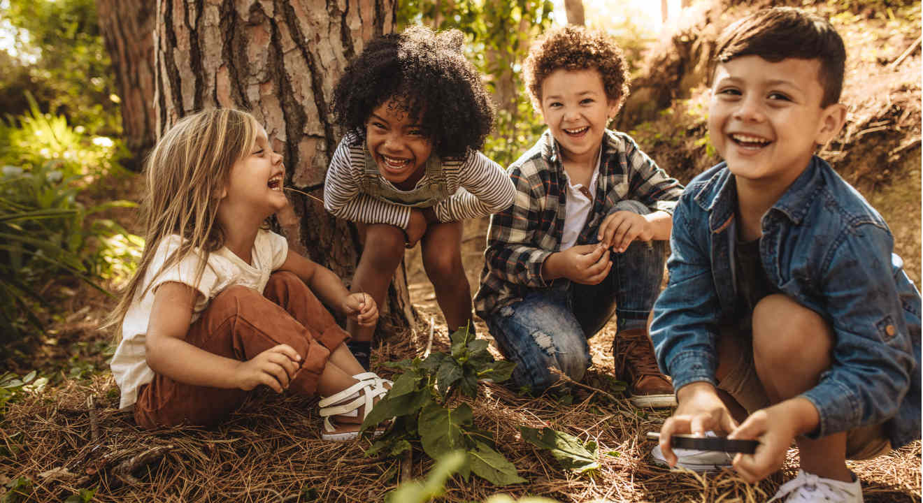 Kids playing in woods together